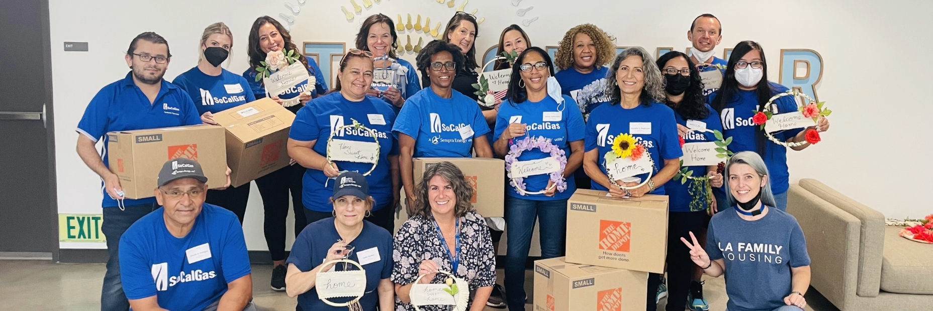 A group of socalgas volunteers posing for a picture at the event