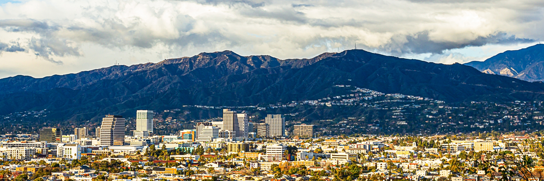 Generic image of city with mountains in the background