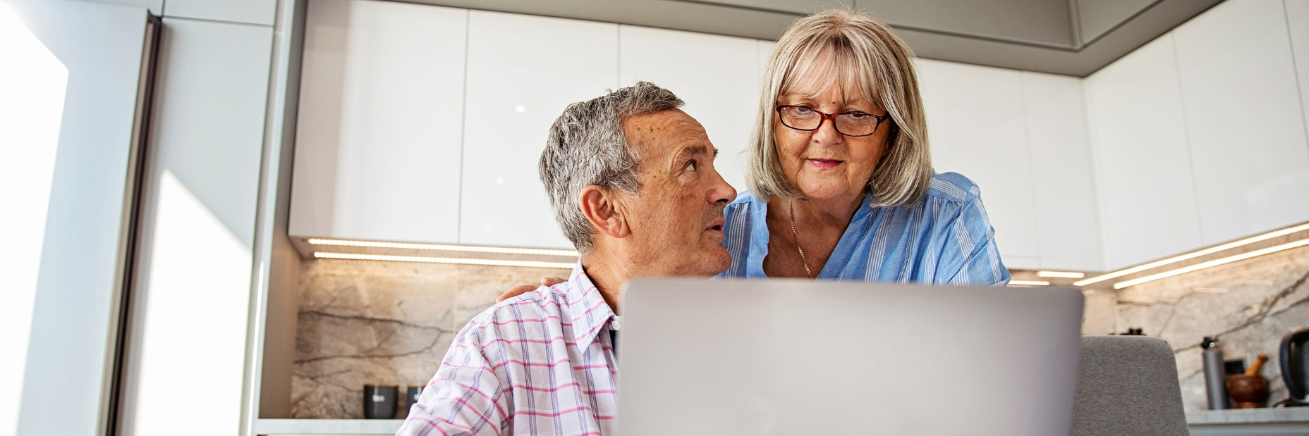 Couple Talking in Kitchen