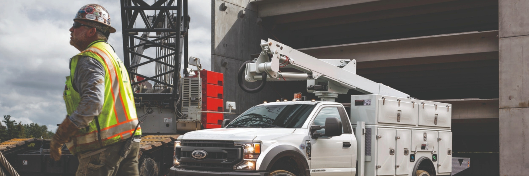 Man standing in front of ford 550 on a work site
