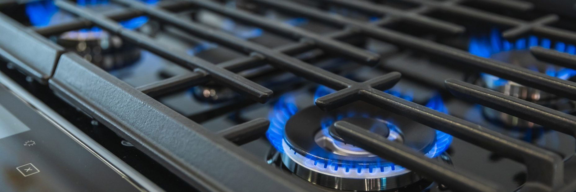 Blue flame burning on a stove top