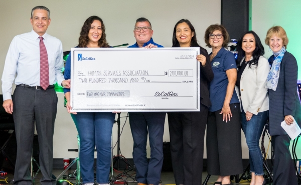 A giant check being presented to the organization