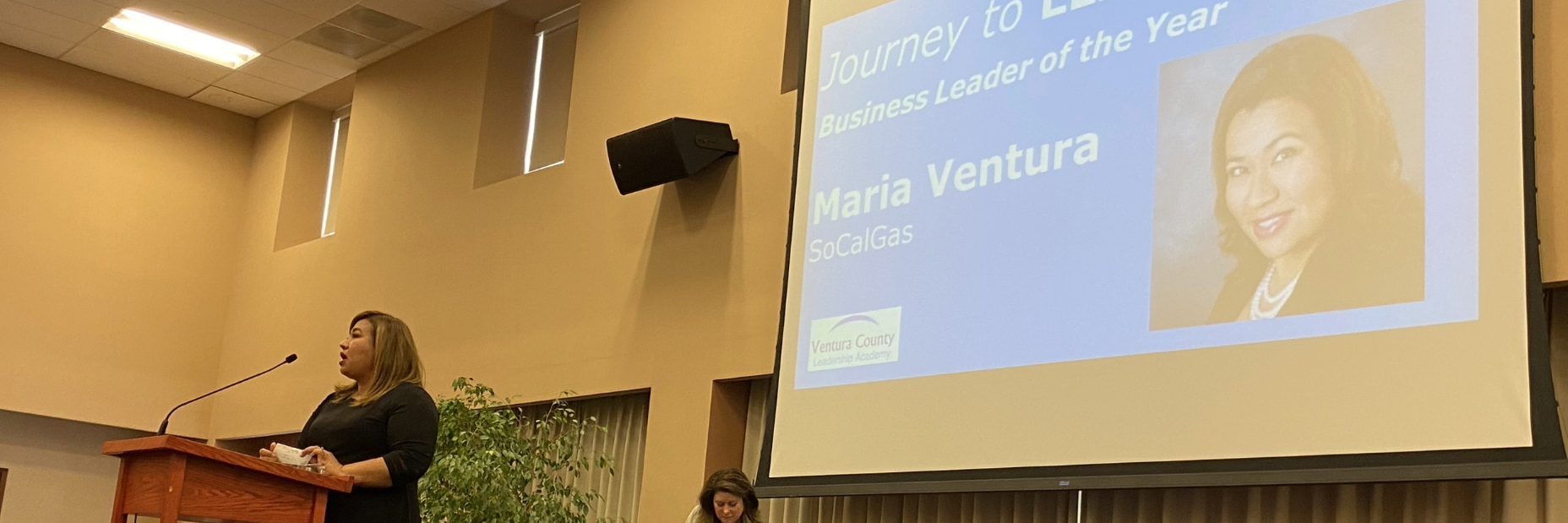 Maria Ventura at the podium at the 2022 Business Leader Awards