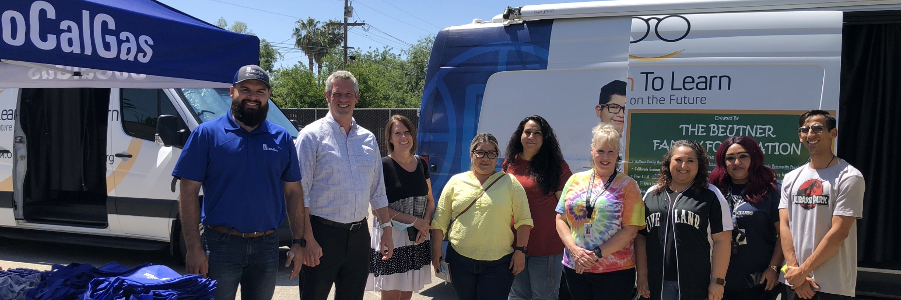 People from Vision to Learn standing in front of a socalgas pop up tent