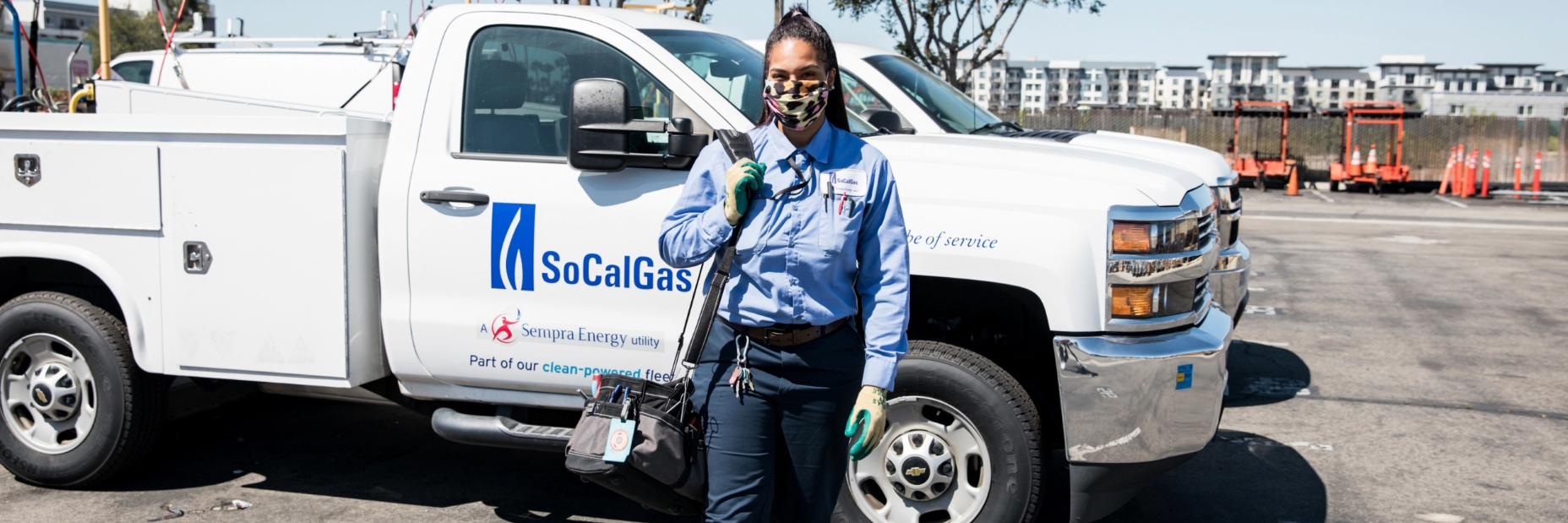 Female worker walking in front of socalgas service truck