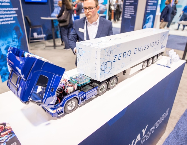 A miniature hydrogen semi truck on a booth table