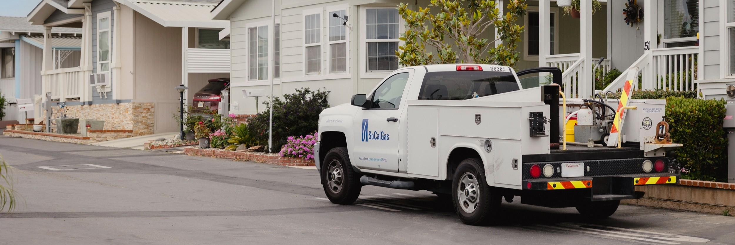 SoCalGas truck in front of mobilehomes. 